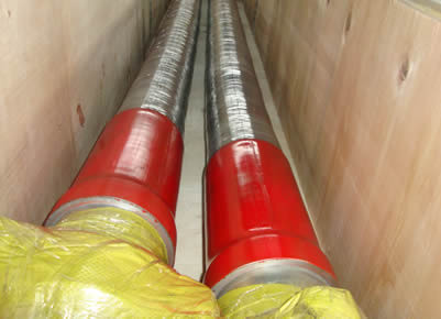Two choke and kill line hoses are in a wooden box.