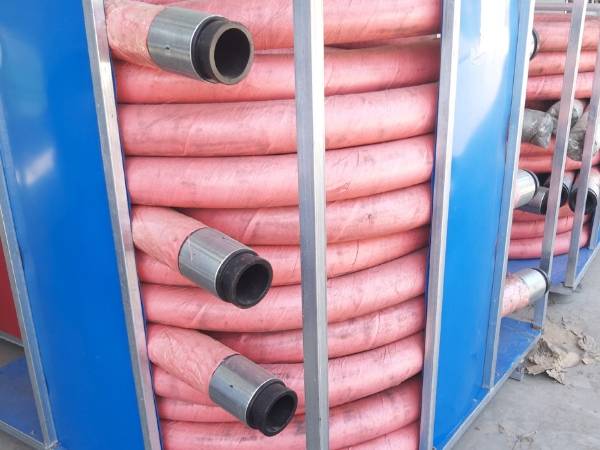 Red concrete placing hose coils are displayed.