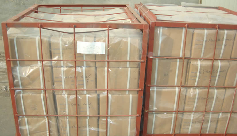 Many cartons containing drilling hose connectors are in the iron cages.