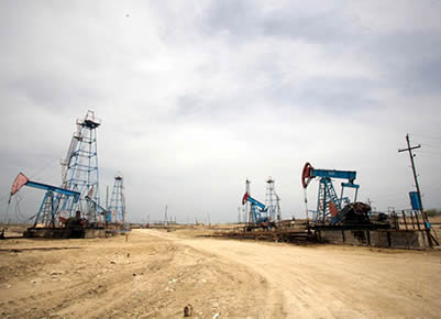 A large oil field with oil extraction equipment.