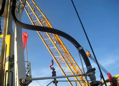 A section of drilling hose is installed on the oil extraction equipment.
