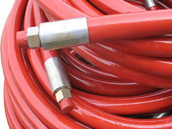 A bundle of fireproof BOP hoses with red surface.