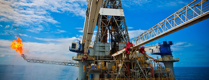 A set of large oil drilling and exploration equipment is on the sea.