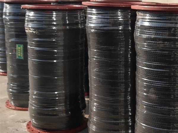 Mud suction and discharge hoses are well packaged and placed on the ground.