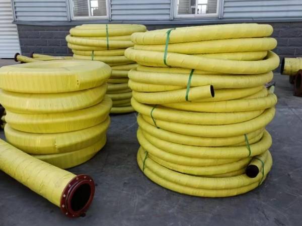 Mud suction and discharge hoses are made into rolls.