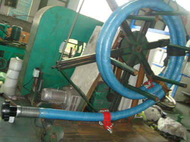 The equipment is making the drilling hose into a roll.