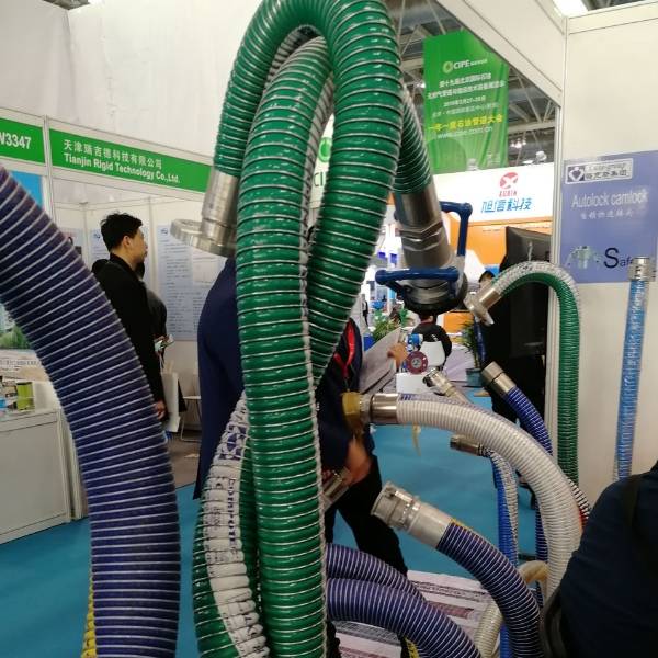 Many suction and discharge composite hoses are displayed.