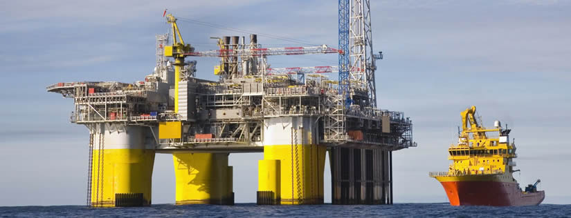 A set of large oil drilling equipment is on the sea.