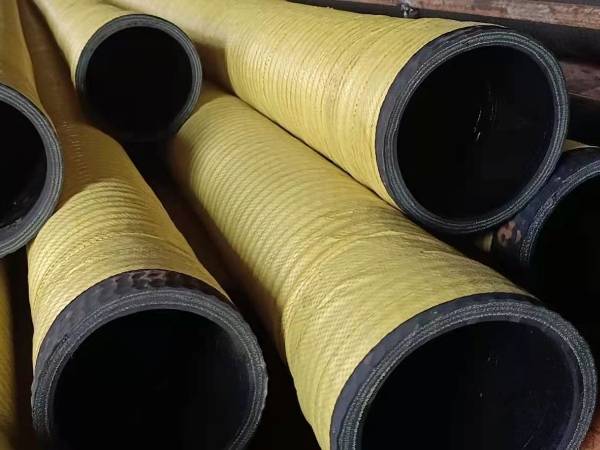 Yellow water suction and discharge hose with a black inner tube